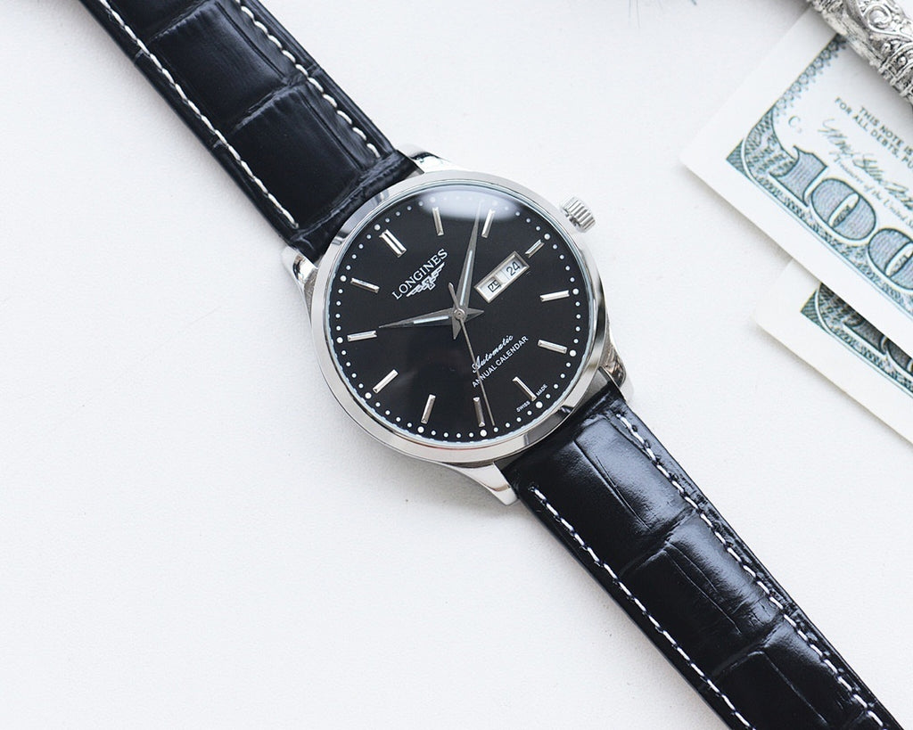 Longines watch with black dial and dark leather strap, round case with crown