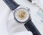 Longines skeleton watch, silver-tone case, white dial, gold-toned movement, navy leather strap