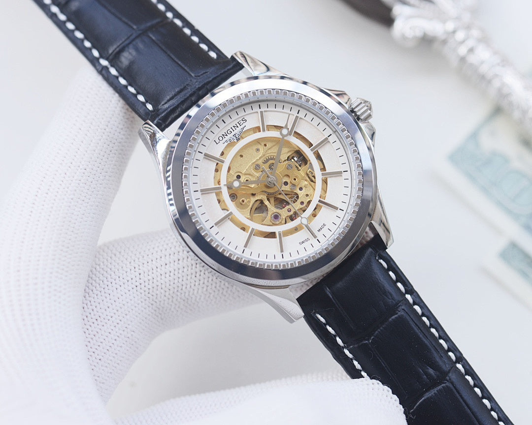 Longines skeleton watch, silver-tone case, white dial, gold-toned movement, navy leather strap