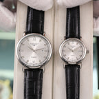 Longines quartz wristwatch with white dial and black leather strap, Roman numerals