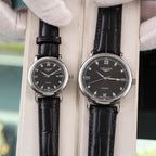 Longines quartz wristwatch with black dial and black leather strap, Roman numerals