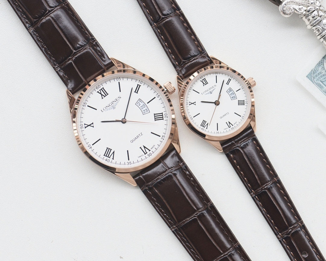 Two white-dial quartz watches, Roman numerals, rose gold cases, dark leather straps