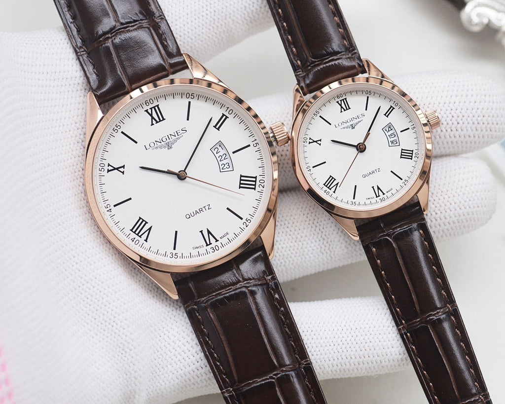 Two white dial quartz watches with Roman numerals, rose gold cases, black leather straps