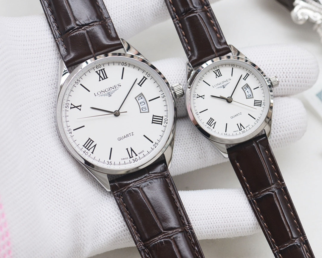 Two white dial quartz watches with Roman numerals, silver cases, black leather straps