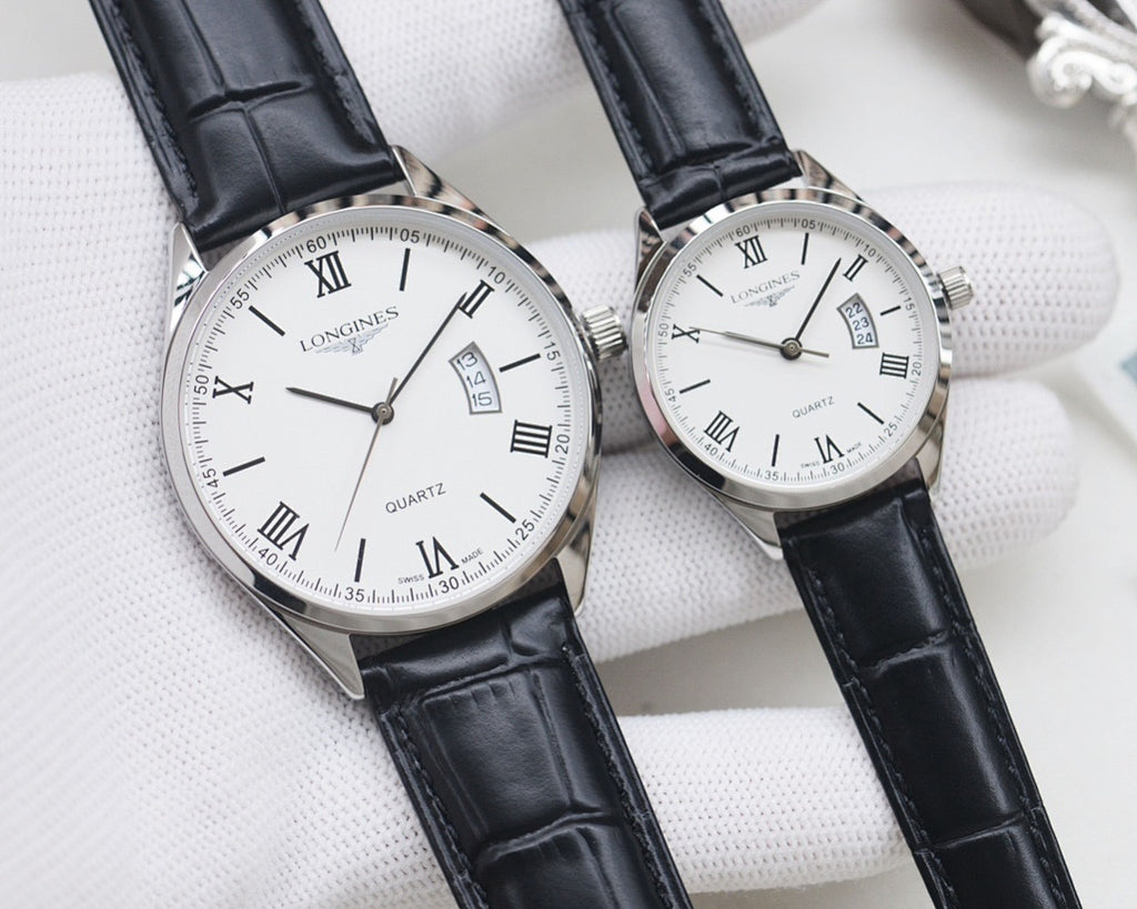 Two quartz watches: black and white dials, silver cases, black leather straps