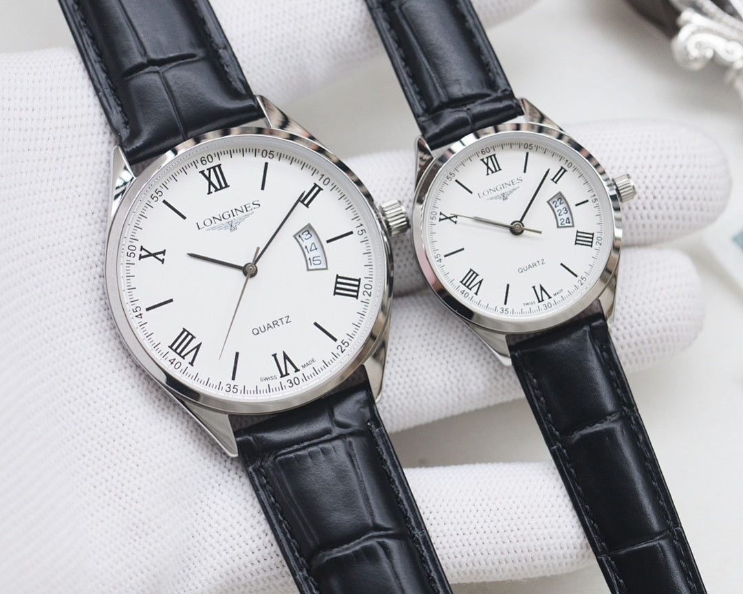 Two quartz watches: black and white dials, silver cases, black leather straps