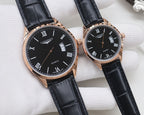 Two black dial quartz watches with Roman numerals, rose gold cases, black leather straps