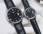 Black dial quartz watch with date window, Roman numerals, black leather strap, steel case