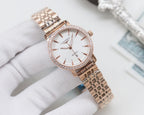 Longines rose-gold tone wristwatch with white dial and metal bracelet