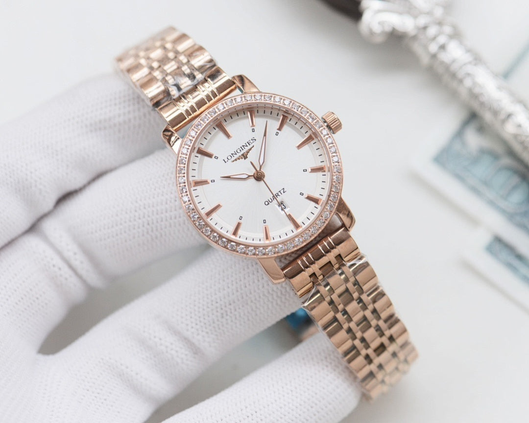 Longines rose-gold tone wristwatch with white dial and metal bracelet