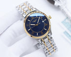 Two-tone Longines watch with blue dial, gold bezel, and silver-and-gold link bracelet.