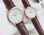 Pair of quartz wristwatches with white dials and brown leather straps