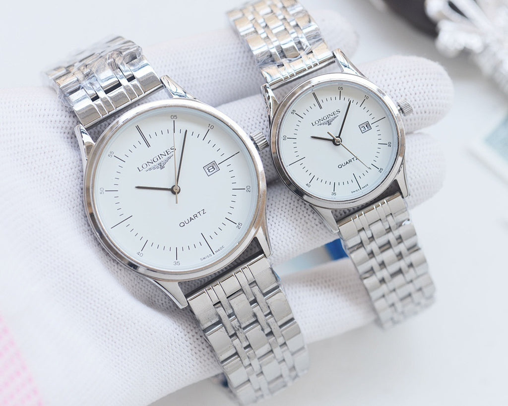 Pair of quartz wristwatches with white dials and silver metal bracelet straps