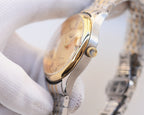 Two-tone stainless steel watch, gold dial and crown with bracelet