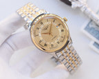 Two-tone stainless steel watch, gold dial with day-date window