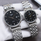 Longines quartz watch pair with silver metal bracelet and black dial, round case, baton markers