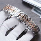 Longines watch bracelet and silver clasp with linked metal band and round metal case