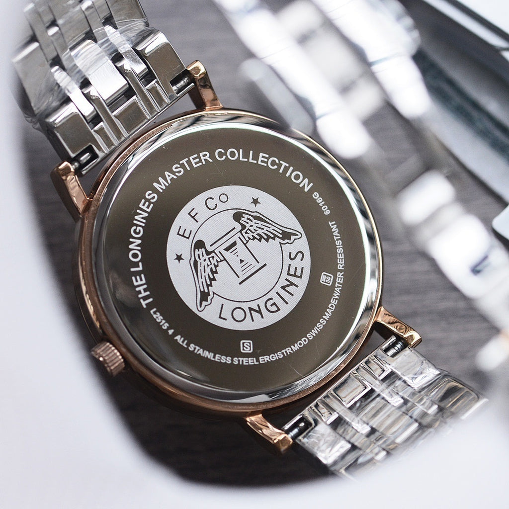Longines watch caseback in stainless steel with engraved text and logo, on metal bracelet
