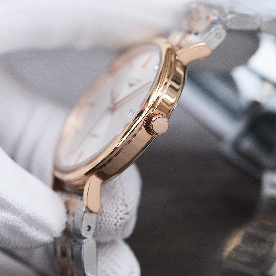 Longines watch with rose gold case and crown, silver metal bracelet, white dial