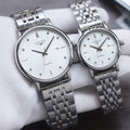 Longines quartz watch pair with silver metal bracelet and white dial, round case, hour markers