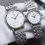 Longines quartz watch pair with silver metal bracelet and white dial, round case, hour markers