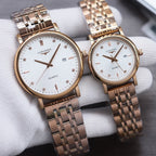 Longines quartz watch pair with rose gold metal bracelet and white dial, round case, markers