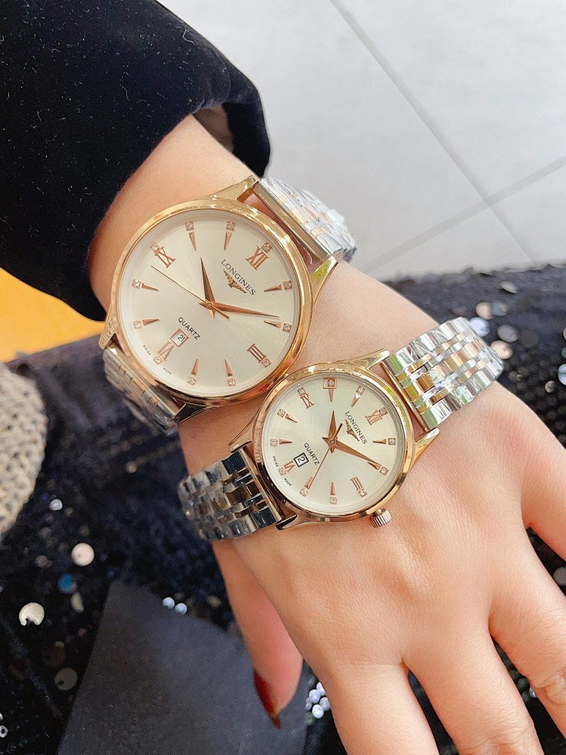 Longines watches on wrists with gold-tone bands and light cream round dials