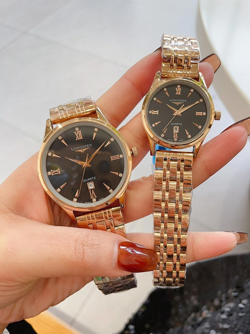 Longines watch pair with gold-tone metal bracelets and dark round dials