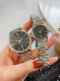 Longines watch pair with silver metal bracelets and black round dials