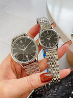 Longines watch pair with silver metal bracelets and black round dials