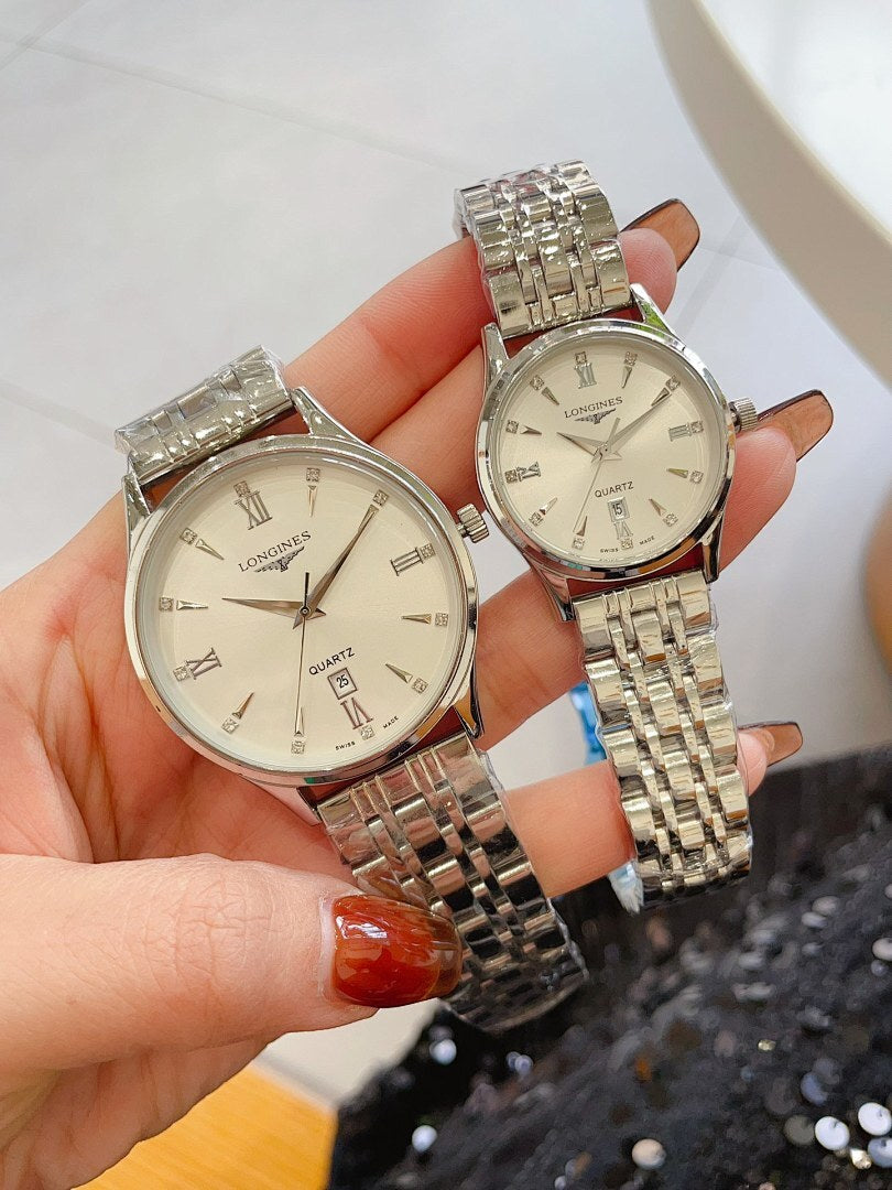 Longines watch pair with silver metal bracelets and light cream round dials
