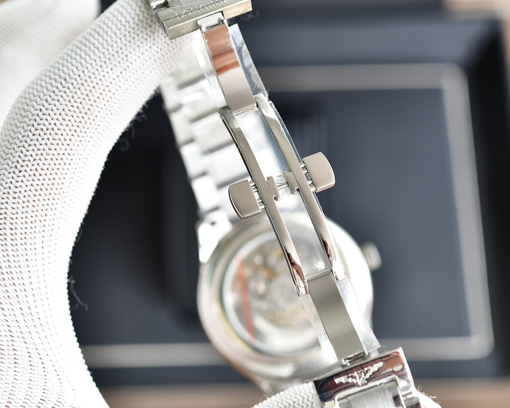 Longines automatic watch with silver metal link bracelet and side crown at top