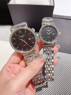 Longines stainless steel watch with dark dial, Roman markers, metal link bracelet