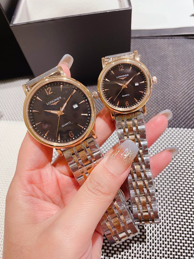 Pair of Longines watches with dark dials, gold-toned bezels, steel link bracelets