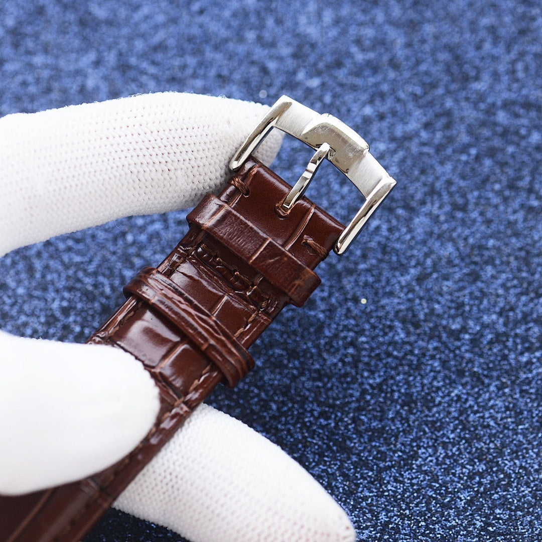 Longines watch with brown leather strap and silver buckle