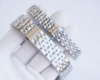 Stainless steel bracelet link detail of a Longines wristwatch, clasp and case edge