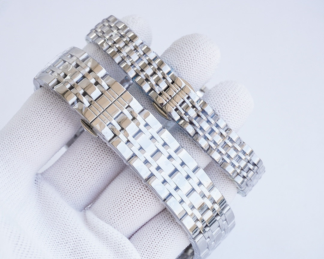 Stainless steel bracelet link detail of a Longines wristwatch, clasp and case edge