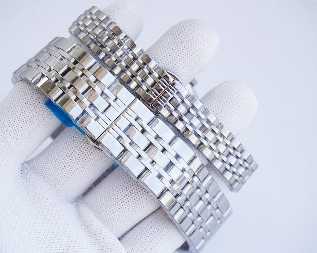Longines quartz wristwatch with stainless steel bracelet and silver case, blue accent detail