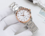 Longines watch with white dial, rose-tone bezel, and silver stainless bracelet