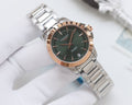 Longines watch with dark green dial and silver stainless bracelet, round case