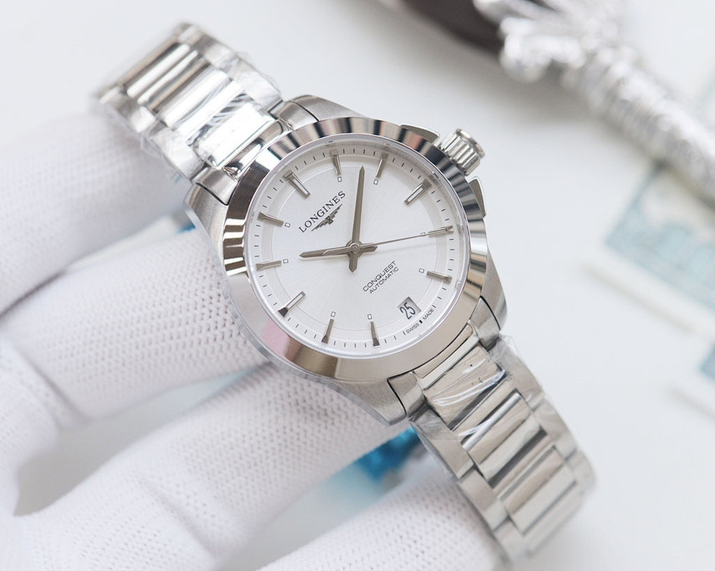 Longines watch with white dial and silver stainless bracelet, round case