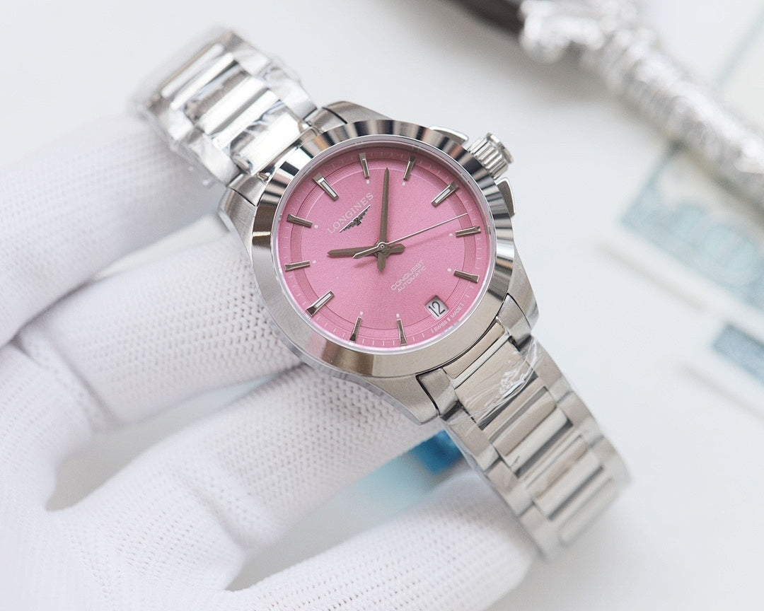 Longines watch with bright pink dial and silver stainless bracelet, round case
