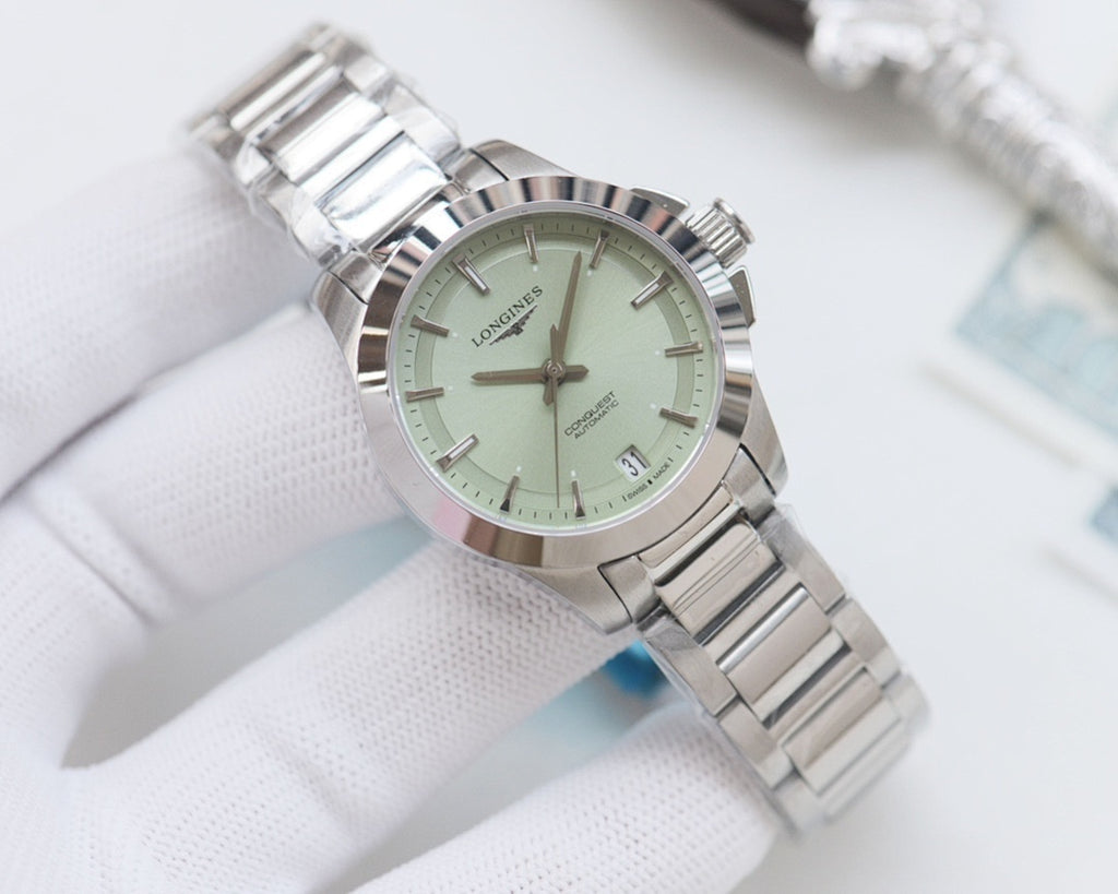 Longines watch with light green dial and silver stainless bracelet, round case