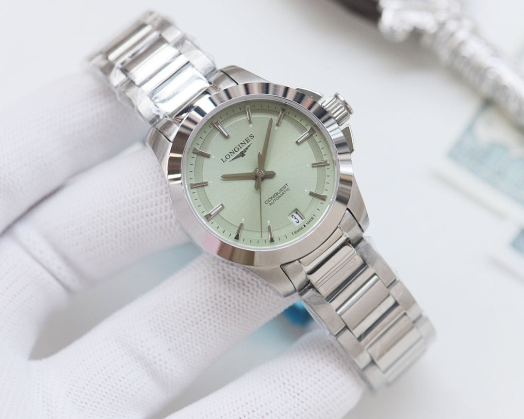 Longines watch with light green dial and silver stainless bracelet, round case