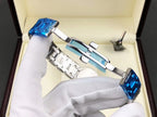 Longines wristwatch shown in open box with blue accents and silver metal bracelet