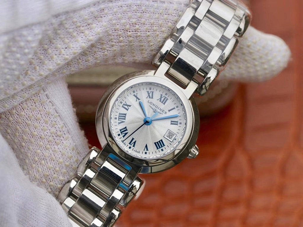 Longines wristwatch close-up: white dial, Roman numerals, blue hands, steel bracelet