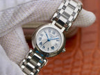 Longines wristwatch close-up: white dial, Roman numerals, blue hands, steel bracelet