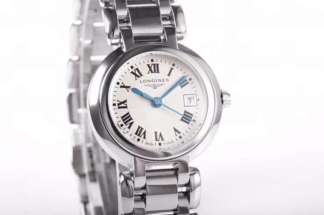 Longines wristwatch macro view of white dial, Roman numerals, blue hands, steel case