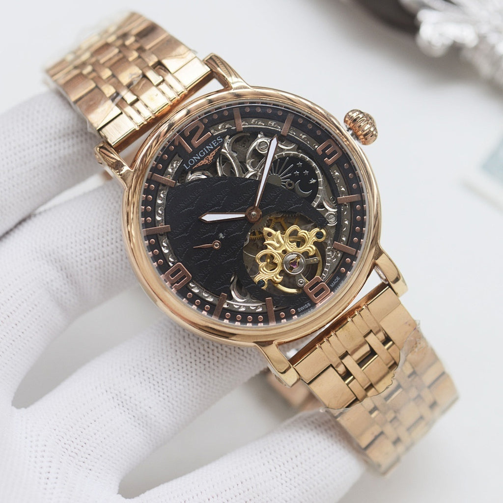 Longines wristwatch, gold-tone metal bracelet and dark dial with open-heart skeleton movement