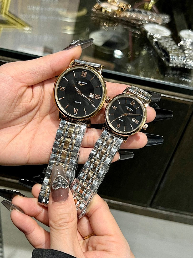 Pair of round wristwatches with black dials and silver metal link bracelets